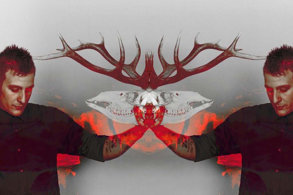 BEN DEER HOLDING DEER SKULL RED WHITE PIC